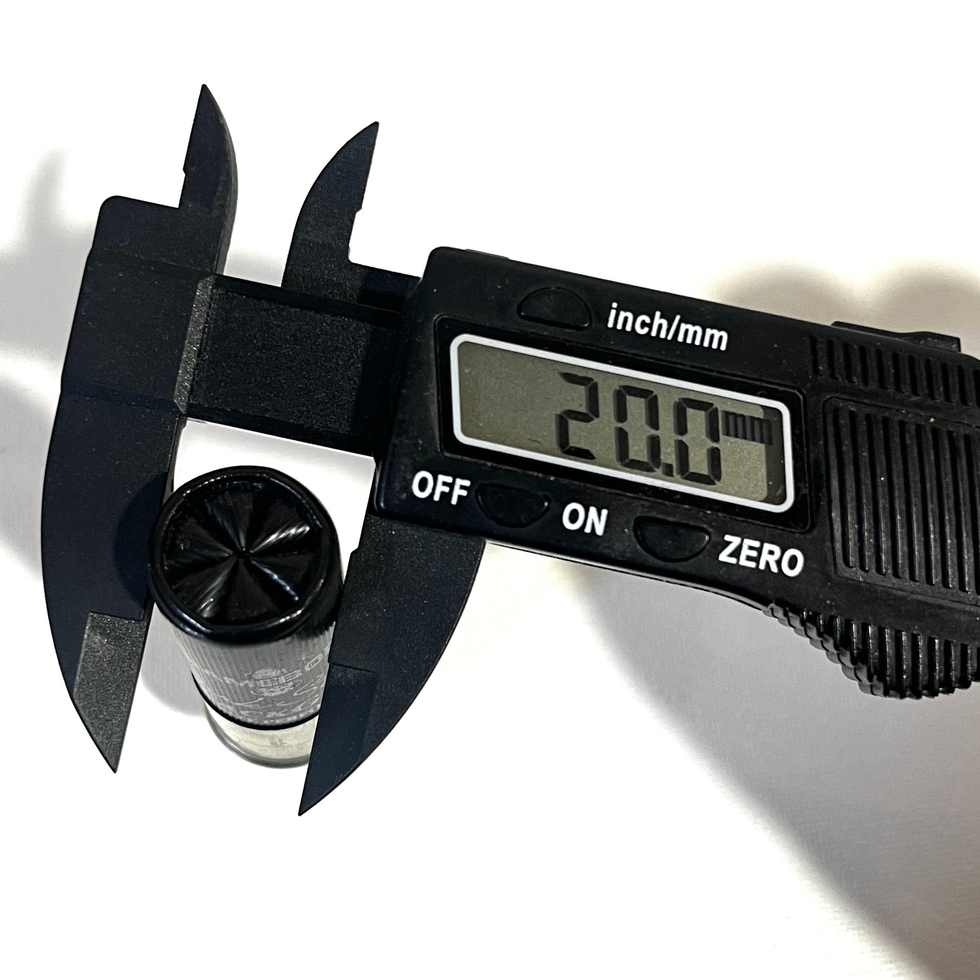 Gamebore Black fake shotgun hull measured with calipers at 20 mm in diameter