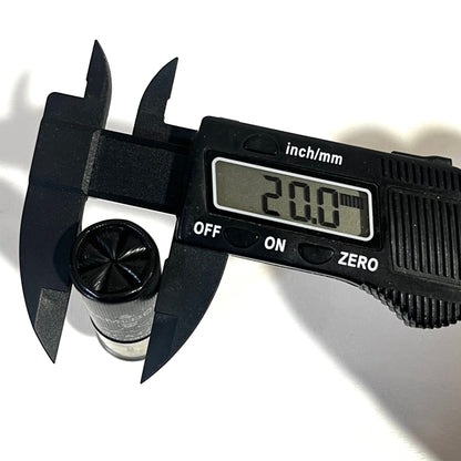 Gamebore Black fake shotgun hull measured with calipers at 20 mm in diameter