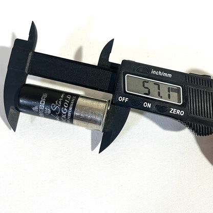 Gamebore Black Gold fake shotgun shell measured with calipers at 57.1 mm in length