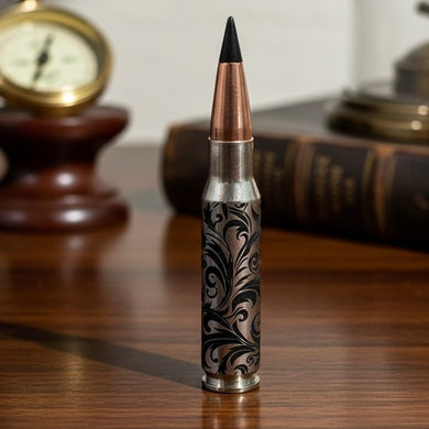 Baroque scroll engraved inert bullet casings with distinctive black tips, presented as unique decorative art