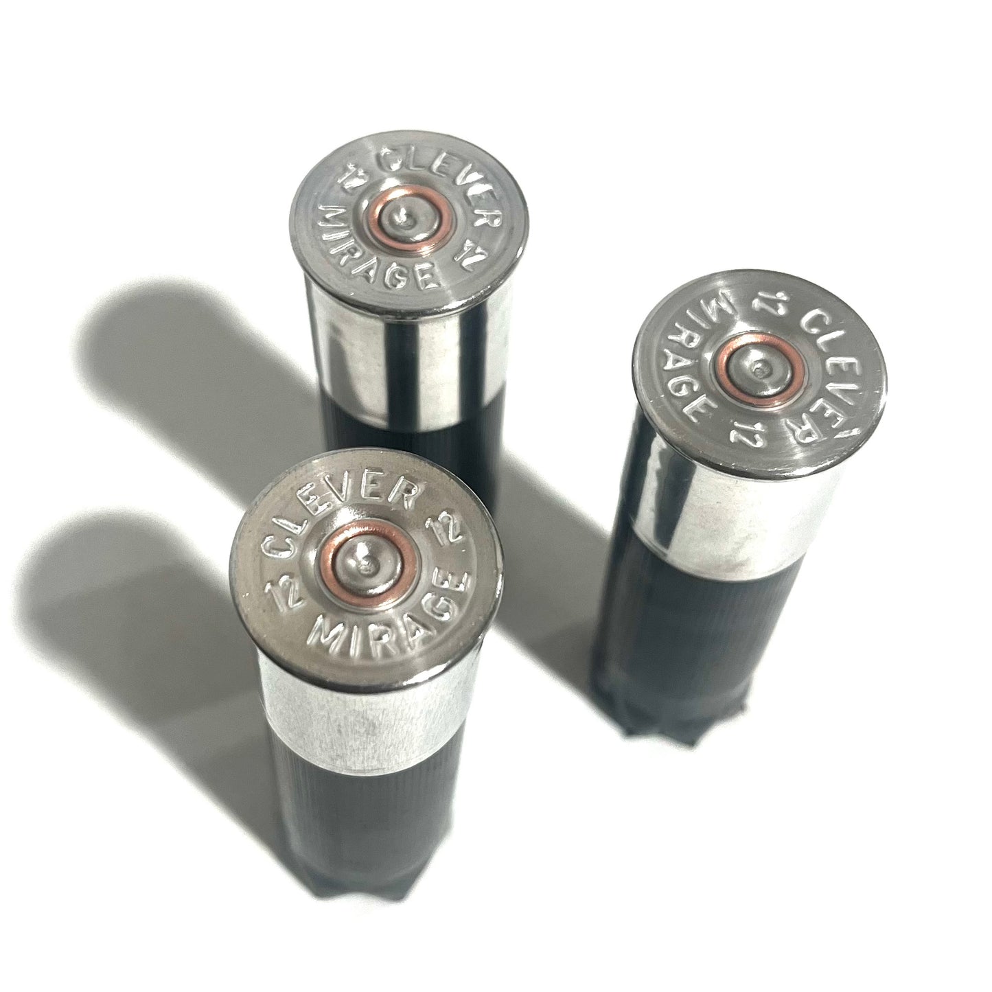 Three black shotgun shells showing Clever Mirage 12 headstamps on their high brass bottoms