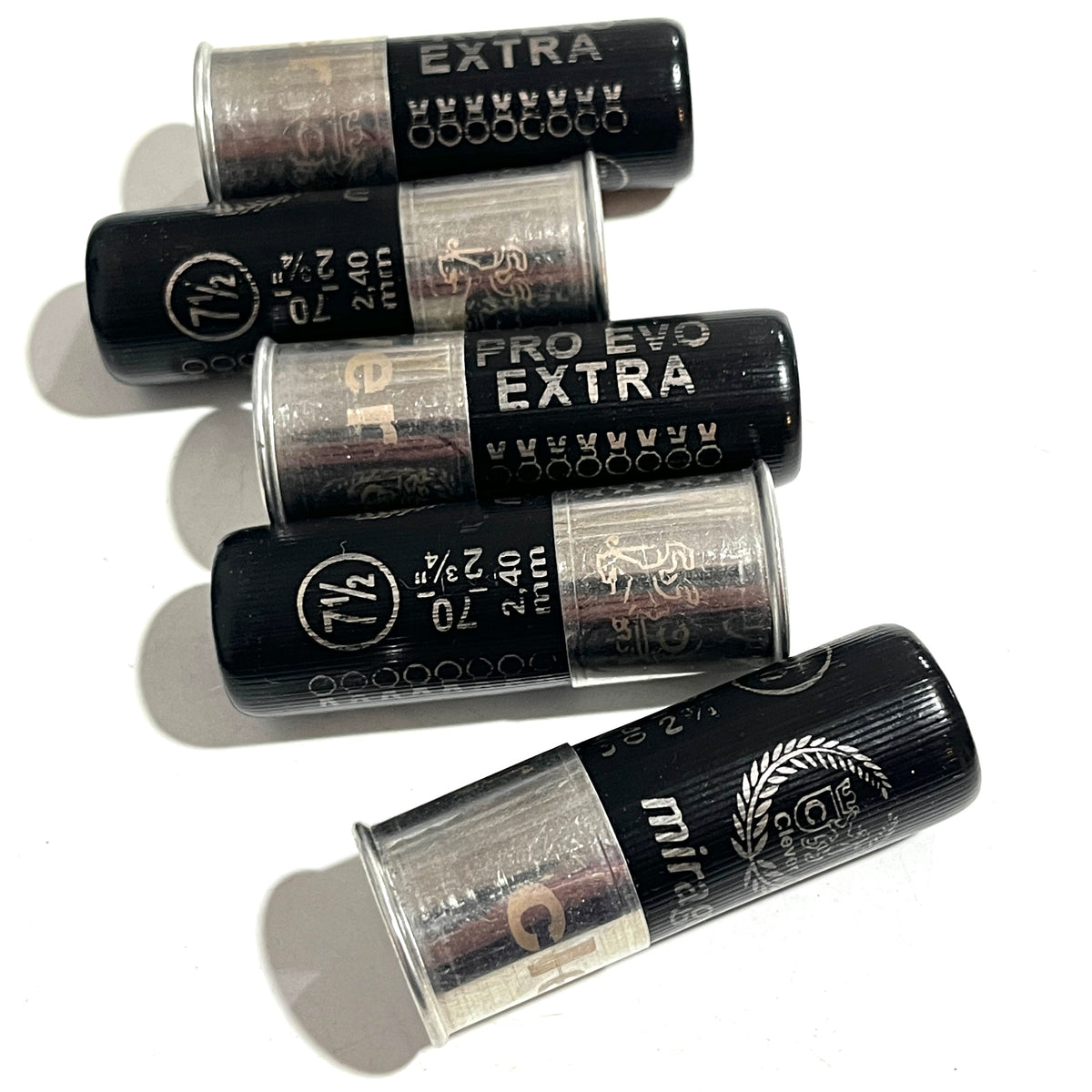 Five black 12-gauge shotgun hulls arranged diagonally, showing printed "PRO EVO EXTRA" text and crimped tops.