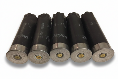 Five black Remington 12 gauge spent casings lined up showing metal headstamps and primer bases.