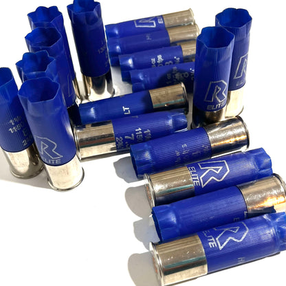 Blue hulls with shiny high brass silver bottoms lying stacked together on a white background.