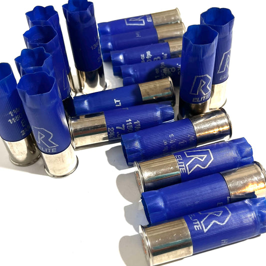 Blue hulls with shiny high brass silver bottoms lying stacked together on a white background.