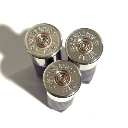 3 silver 12 gauge shotgun shell base caps stamped Bornaghi 12 Italy, viewed from above