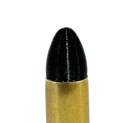 Close-up of a fake 9mm Luger dummy round black painted bullet tip and brass casing