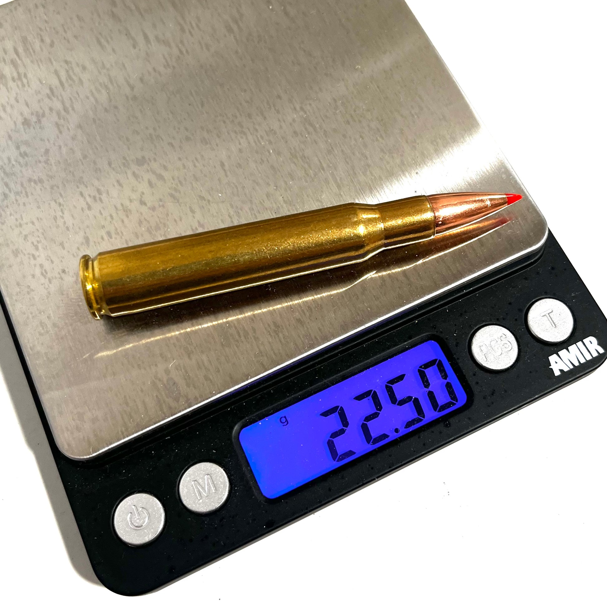 One brass 30-06 red tip dummy casing on a digital scale reading 22.50 grams.