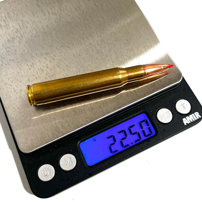 One brass 30-06 red tip dummy casing on a digital scale reading 22.50 grams.