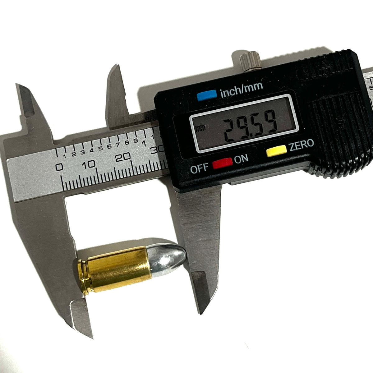 A digital caliper measures the overall length of a brass 9mm dummy round at 29.59 mm.