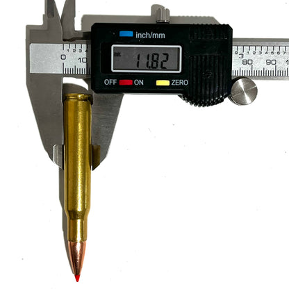 One brass red tip dummy round measured with a caliper showing 11.82 mm diameter.