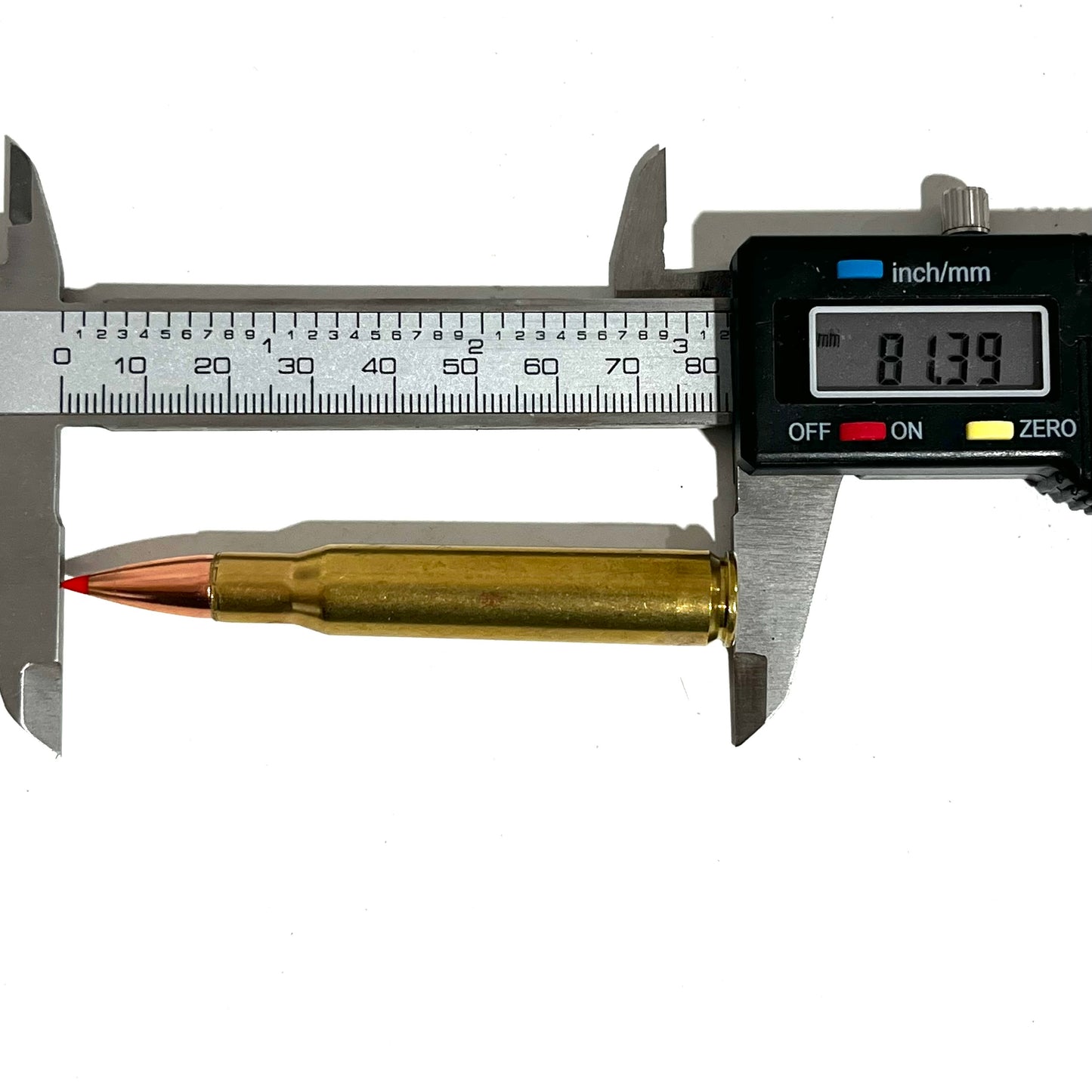 One brass red tip shell measured with a digital caliper reading 81.39 mm.