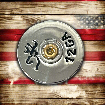 Silver Browning 12 gauge shotgun shell slice on a rustic American flag background