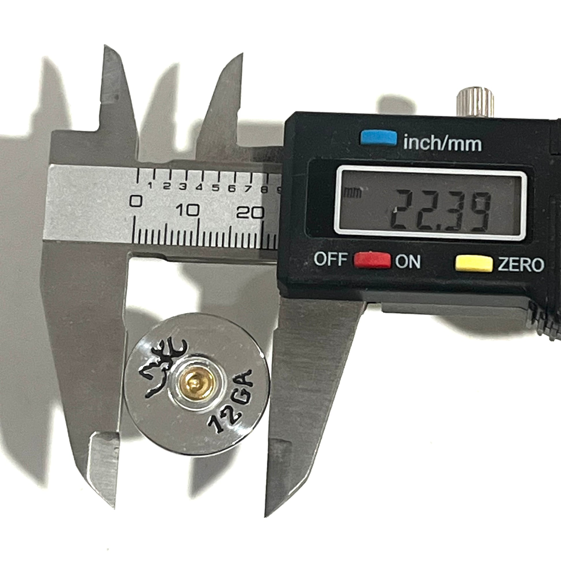 Digital caliper measuring a Browning shotgun shell slice at 22.39 mm across