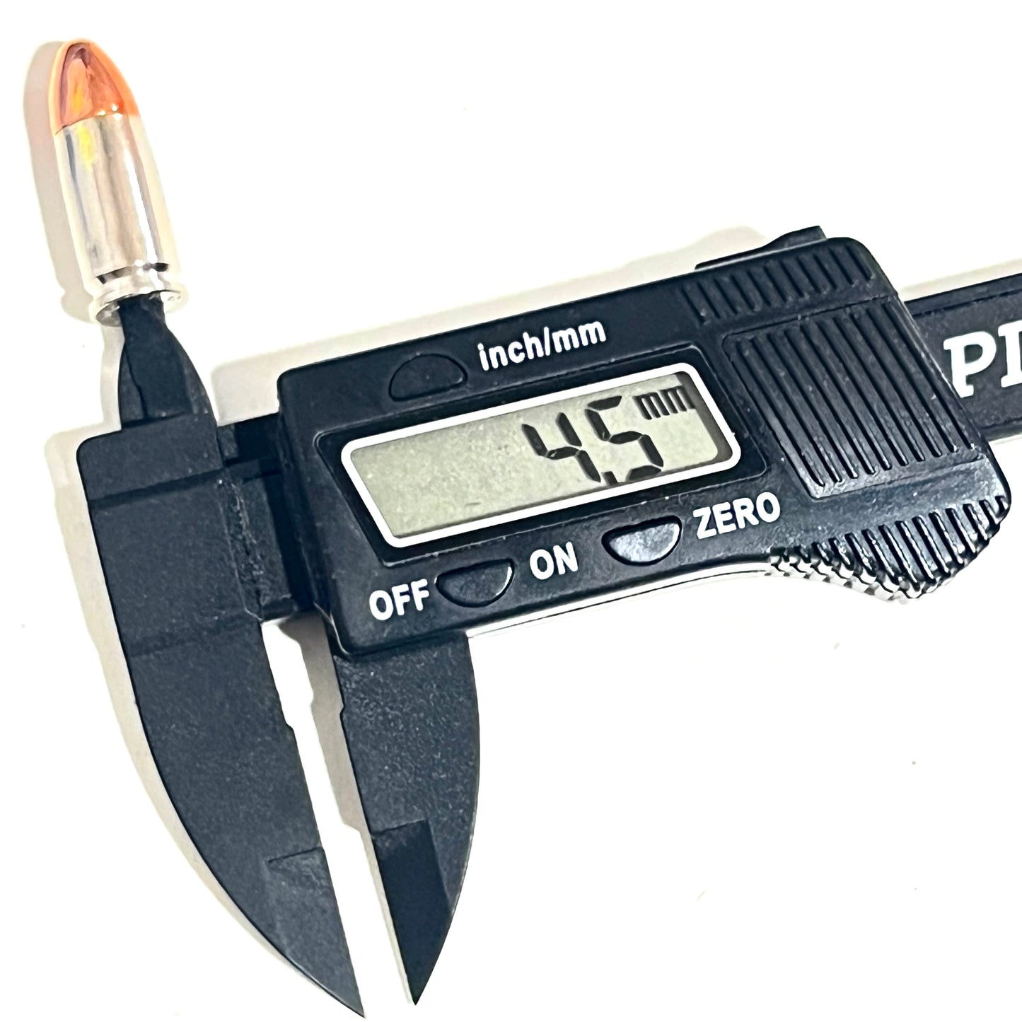 A black digital caliper measuring the primer pocket diameter of a nickel 9mm casing, reading 4.5 mm.