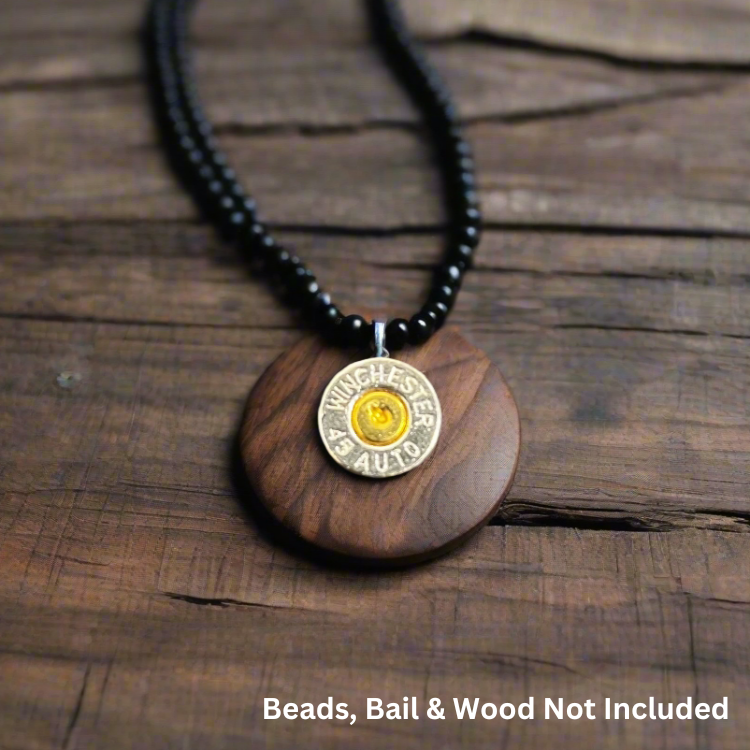Nickel 45 ACP bullet slice pendant with gold primer on a wood disc and black beaded necklace, with text reading Beads, Bail and Wood Not Included