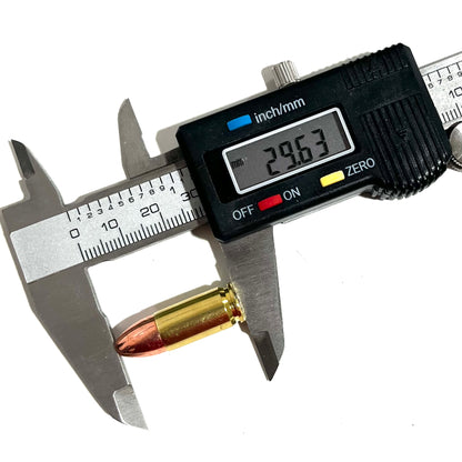 9mm dummy round being measured with a digital caliper showing length for cosplay prop accuracy and ammo crafts.
