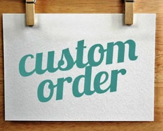 Custom order sign hand-lettered on paper, clipped to a wood board