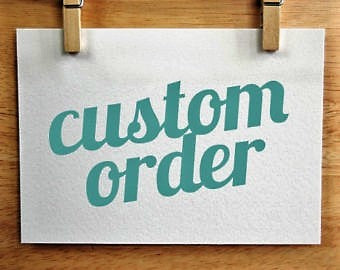 A handwritten custom order sign clipped to a wooden board