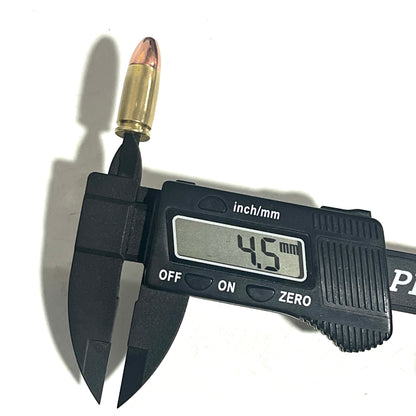 Black digital caliper measuring a 9mm dummy round cartridge on a white background, displaying 4.5 mm on the screen.