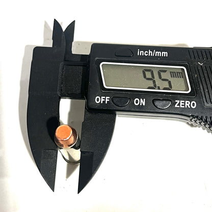 Digital caliper measuring the diameter of a copper flat nose bullet at 9.5 millimeters
