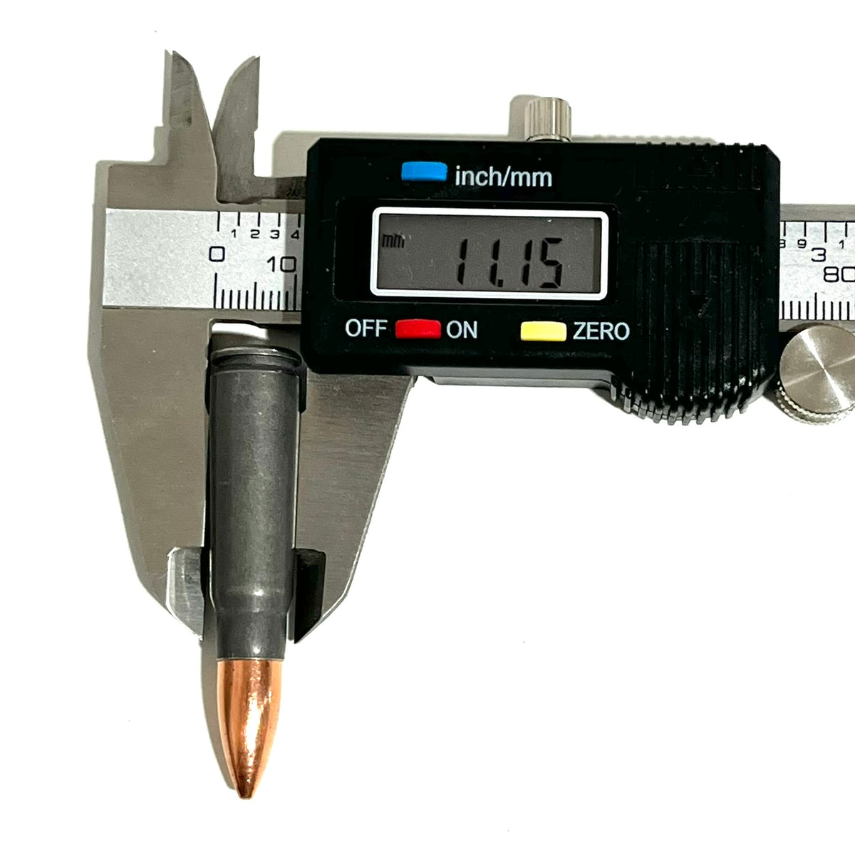 A steel 7.62x39 dummy casing measured for diameter with a digital caliper reading 11.15 mm.