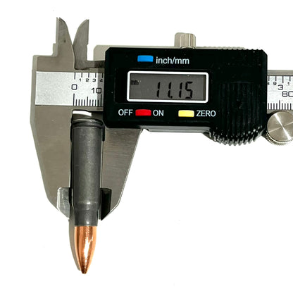 A steel 7.62x39 dummy casing measured for diameter with a digital caliper reading 11.15 mm.
