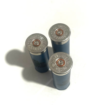 Three blue shotgun shells showing silver Challenger headstamps with copper primers