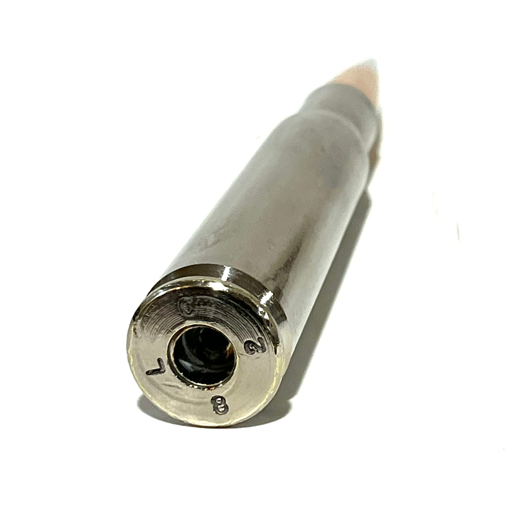 Empty primer pocket on polished silver nickel 50 cal BMG dummy round from Empty Shotgun Shells for film prop use.
