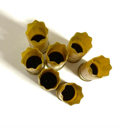 Federal 20 gauge empty shotgun shells, yellow hulls with star-crimped tops for rustic farmhouse holiday wreaths.
