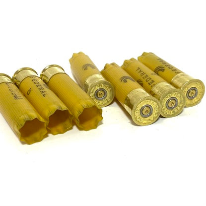 Federal 20 gauge empty shotgun shells, a pile of yellow plastic hulls for large-scale country wedding centerpieces.
