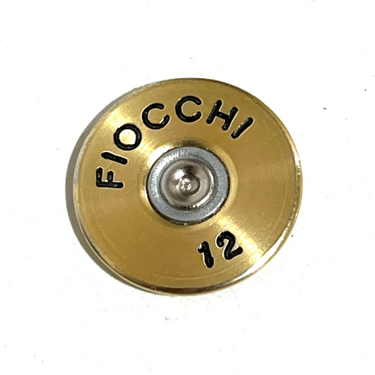 Close-up of one gold Fiocchi 12 gauge shotgun shell slice with black hand-painted lettering and silver primer