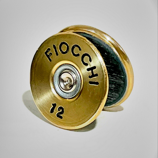 Two gold Fiocchi 12 gauge shotgun shell slices stacked at an angle on a gray background