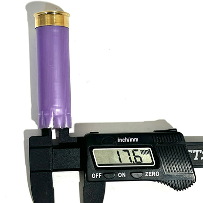A light purple once-fired cartridge measured with digital calipers reading 17.6 mm
