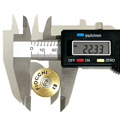 Digital caliper measuring a gold Fiocchi 12 gauge shotgun shell slice at 22.33 mm across