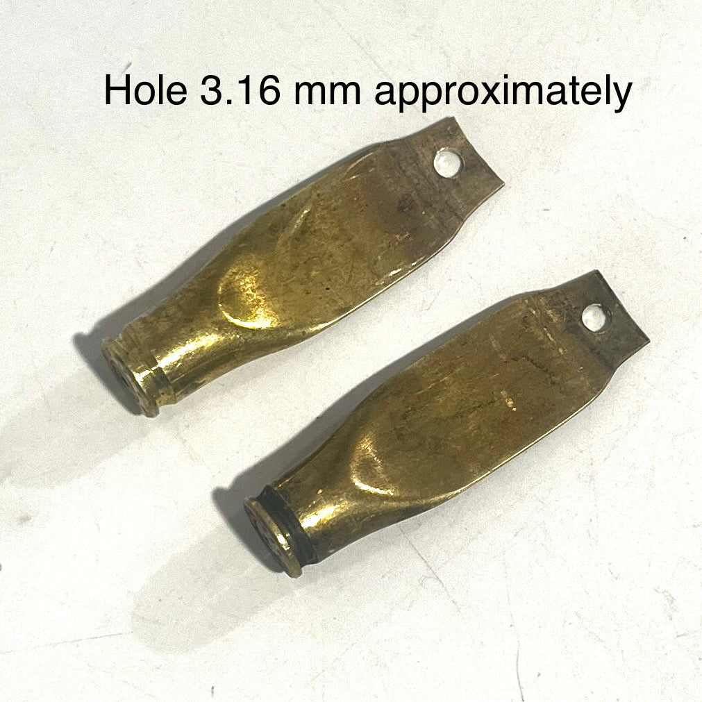 2 flattened brass casings with drilled holes labeled Hole 3.16 mm approximately