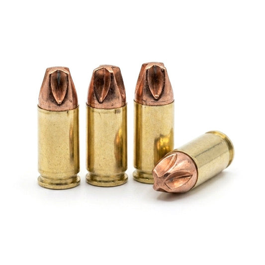 Four 9mm dummy rounds with brass casings and copper hollow point tips on a white background