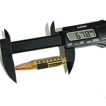 Digital caliper measuring an engraved 'FREEDOM' brass .308 casing, showing a 67.8 mm length reading