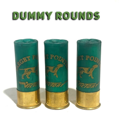 Three green Victory 12 gauge once-fired dummy rounds with gold bases and a Target Pointer dog design