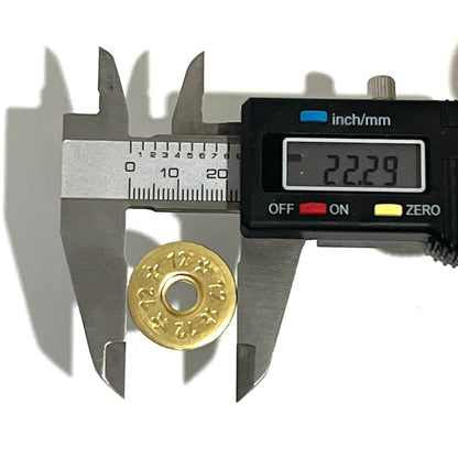 Digital caliper measuring the diameter of a deprimed 12 gauge brass shotgun shell slice at 22.29 mm