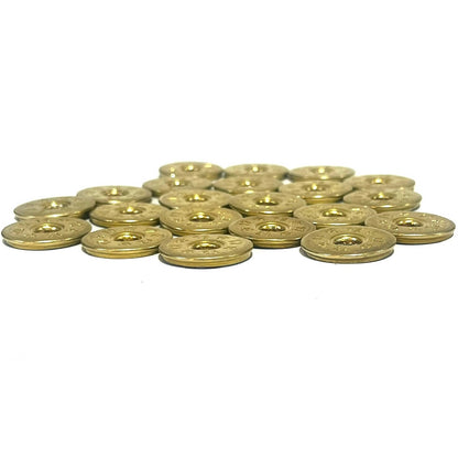 A cluster of deprimed 12 gauge brass shotgun shell slices with 12 and star stamped designs viewed at an angle