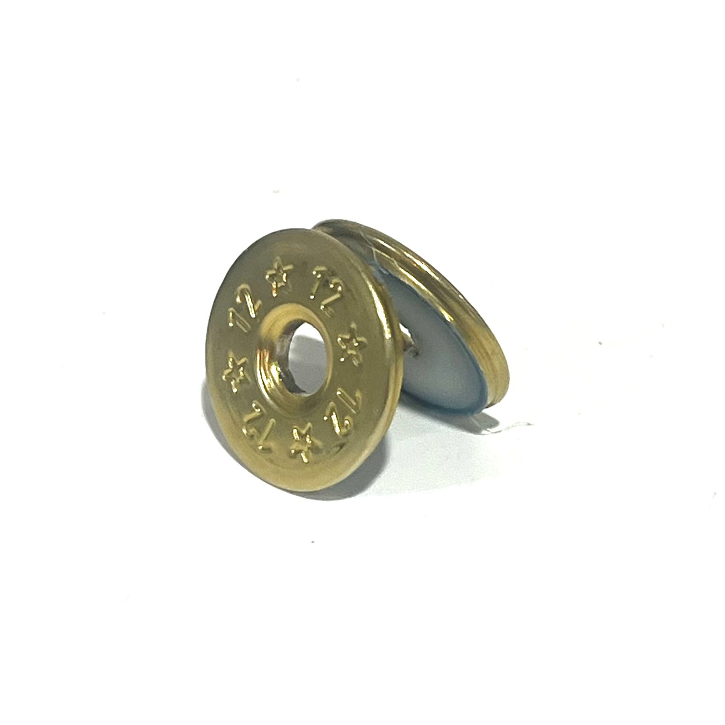 Two deprimed 12 gauge brass shotgun shell slices stacked together, showing 12 and star stamped designs