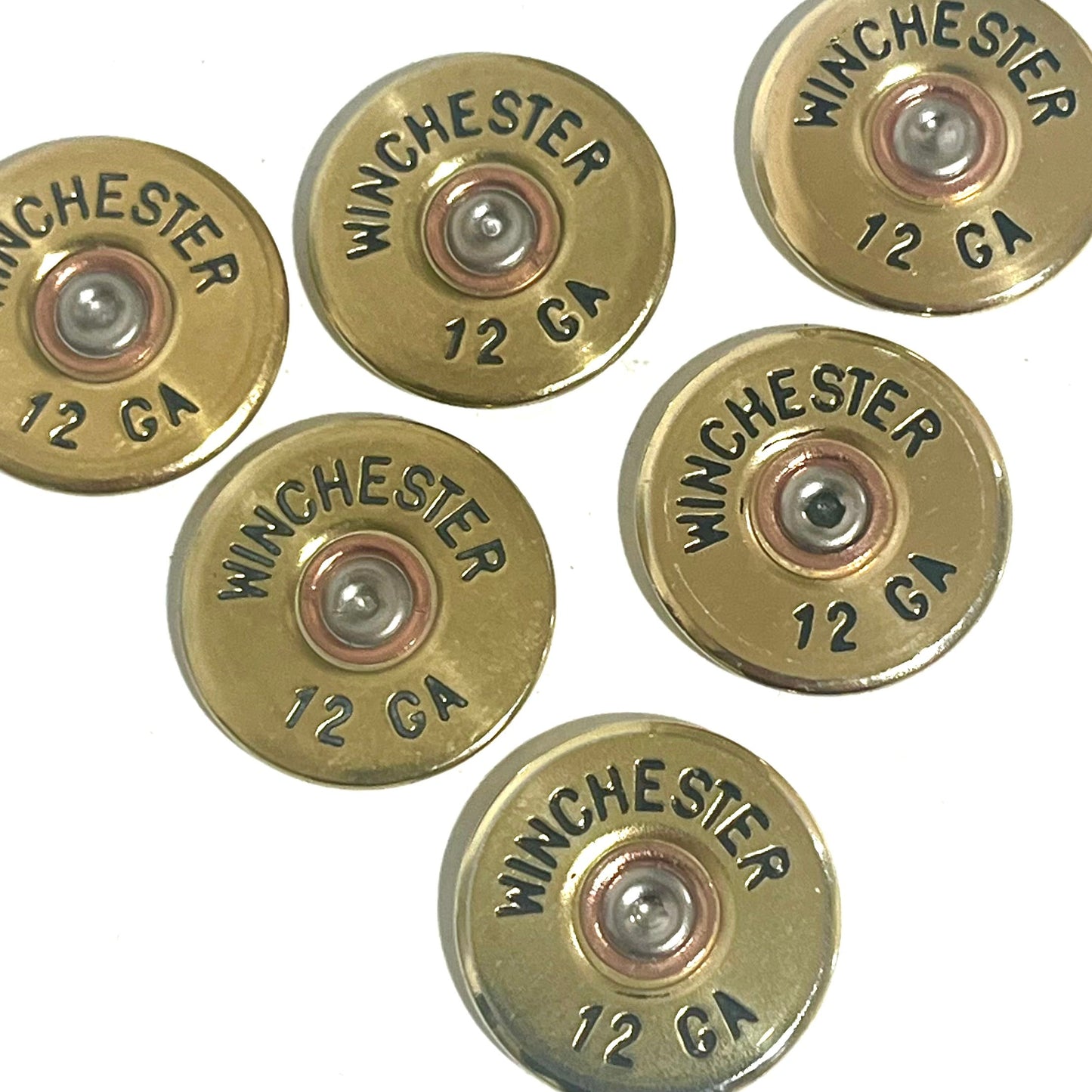6 gold Winchester 12 GA shotgun shell slices with black lettering on a white background