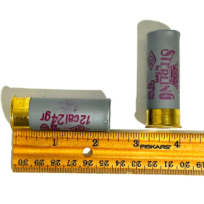 2 gray Sterling 12 gauge shotgun shells next to a Fiskars ruler showing a length of about 2.5 inches