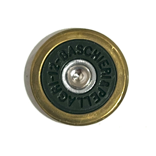 Close-up of a round brass shotgun shell slice with green underside stamped BASCHIERI PELLAGRI 12