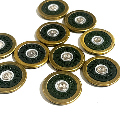 9 round brass shotgun shell slices with green undersides arranged in a cluster showing Baschieri Pellagri headstamps