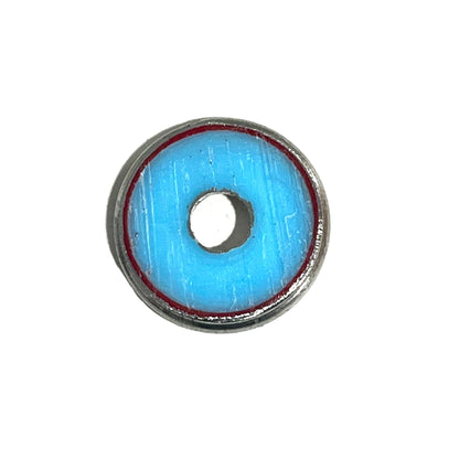 A single hand painted shotgun shell slice with a silver rim and red inner ring on a white background underside view.