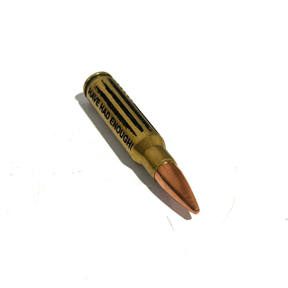 308 Winchester dummy round with HAVE HAD ENOUGH and distressed flag engraving from Empty Shotgun Shells.
