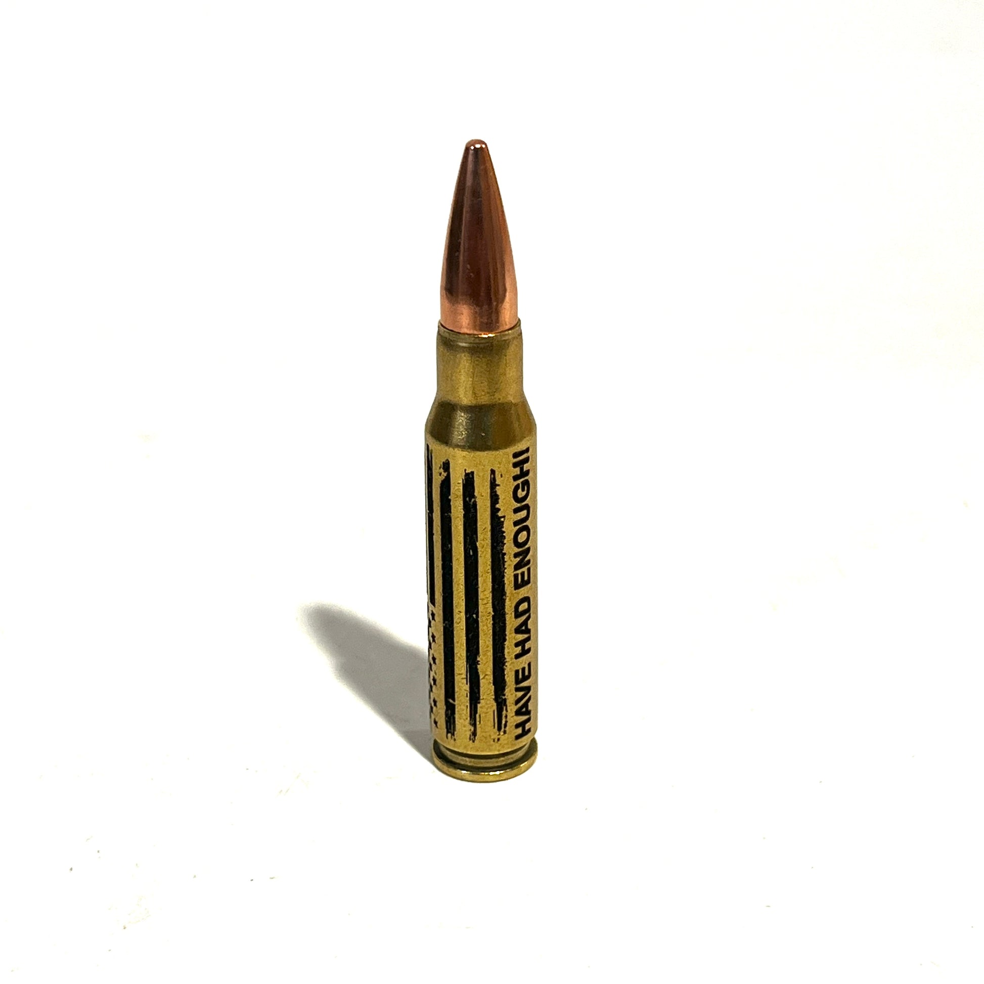 .308 Winchester dummy round with HAVE HAD ENOUGH script and distressed American flag engraved on the brass casing.
