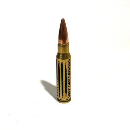.308 Winchester dummy round with HAVE HAD ENOUGH script and distressed American flag engraved on the brass casing.
